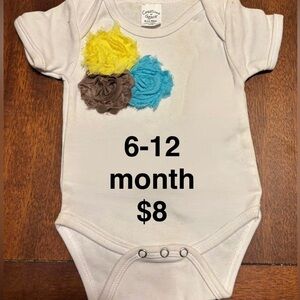 White Baby Onesie with Floral Accents. All baby onesies and bloomers are new